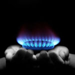 Hands cupping propane flame