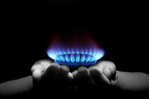 Hands cupping propane flame