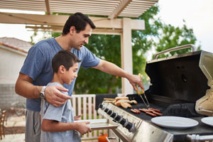 Father and son grilling